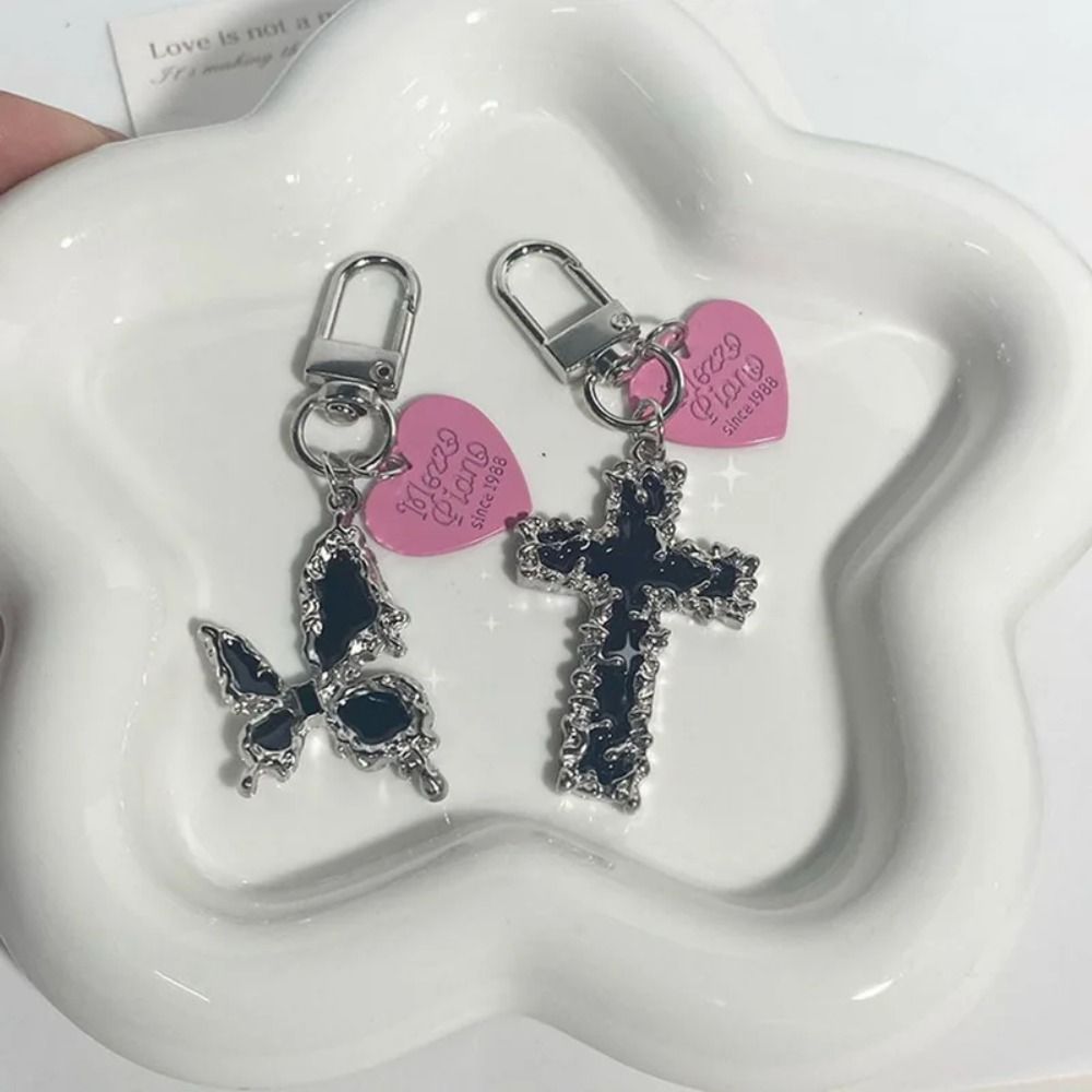 Bag Pendant Butterfly Cross Ke - Tech Girl Accessories recension och pris