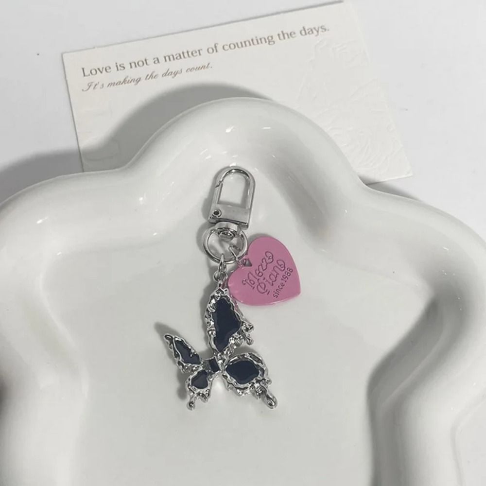 Bag Pendant Butterfly Cross Ke - Tech Girl Accessories recension och pris
